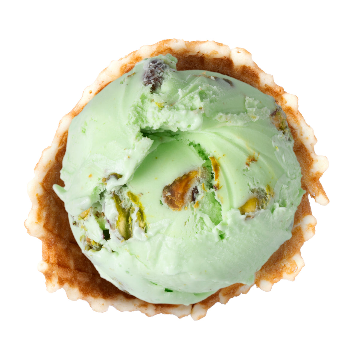 A scoop of light green pistachio ice cream in a waffle cone, shown from a top-down view on a solid white background.