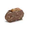 Slice of Kilwins TUTTLE chocolate fudge with pecans and caramel, topped with caramel and nuts.