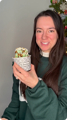Woman holding a Kilwins Dubai sundae