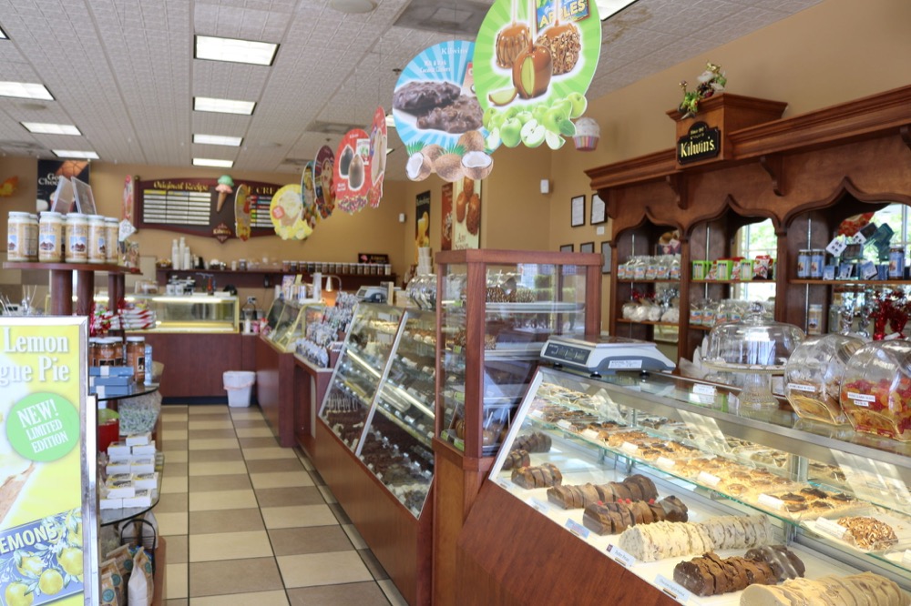 Photo of inside of Kilwins Deerfield Beach, FL store showing product displays