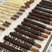 Hand dipped pretzel rods on display