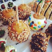 Array of made-in-store treats: Caramel Apples, Chocolate-dipped Strawberries, etc.