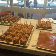 Photo of trays of Caramel Apples on marble table