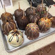 Photo of miscellaneous Chocolate-Dipped Caramel Apples on tray