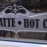 Photo of "Espresso, Latte, Hot Chocolate" decal on store window