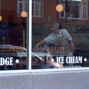An exterior picture of an employee making fudge