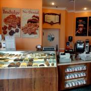 Photo inside Celebration, FL store showing Fudge Case & cash register/counter
